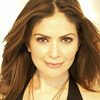 Farah White as Angie the Reporter