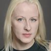 Claire Greasley as Angry Resident in Corridor