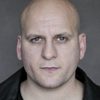 Ricky Champ as Branislav