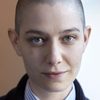 Asia Kate Dillon as The Adjudicator