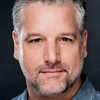 David Starzyk as Bruce Isackson