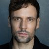 Nick Blood as Adam