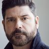John T. Woods as Mark - Career Counselor