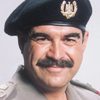 Jerry Haleva as Saddam Hussein