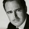 Patric Knowles as Julian March