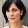 Carrie-Anne Moss as Maggie