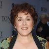 Judy Kaye as Queen Elizabeth II
