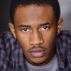 Malcolm David Kelley as Lil Saint