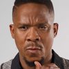 Bongile Mantsai as The Hyena Man