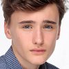 Xavier Atkins as Boy on Bicycle