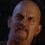 John Watson as Temple Priest