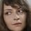 Marina Gera as Woman at Dog Fight