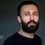Hesam Mahmoudi as Rouzbeh