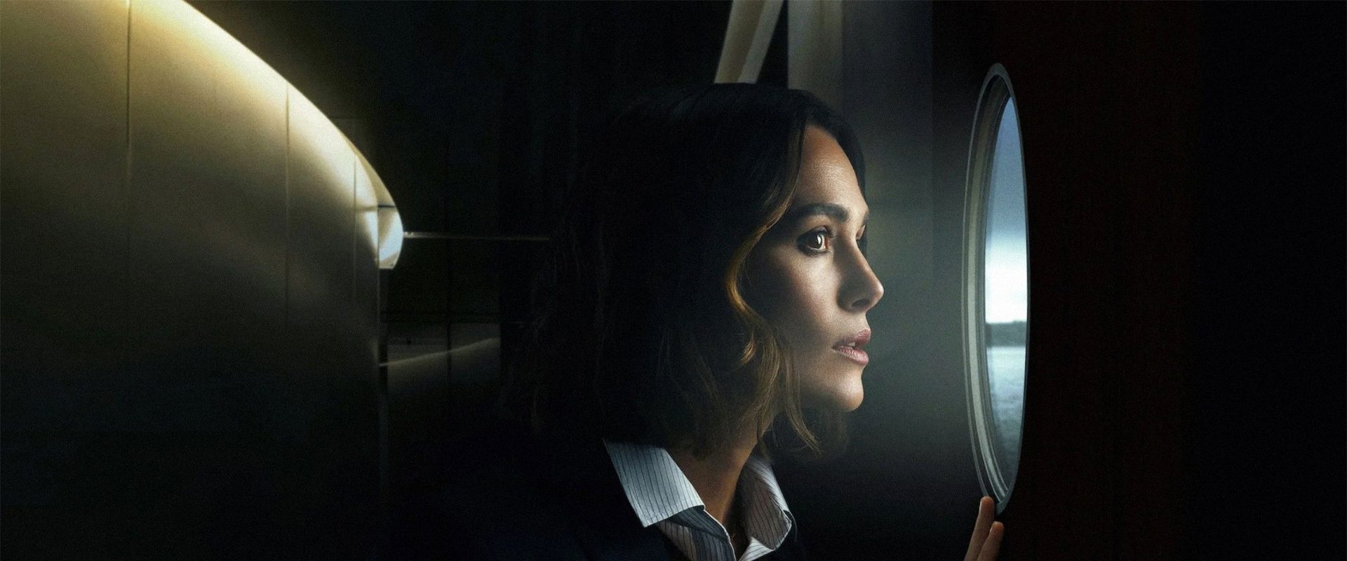 The Woman in Cabin 10 background
