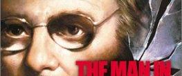 The Man in the Glass Booth background