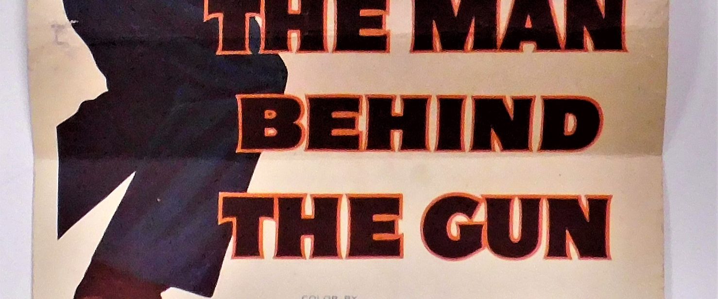 The Man Behind The Gun background