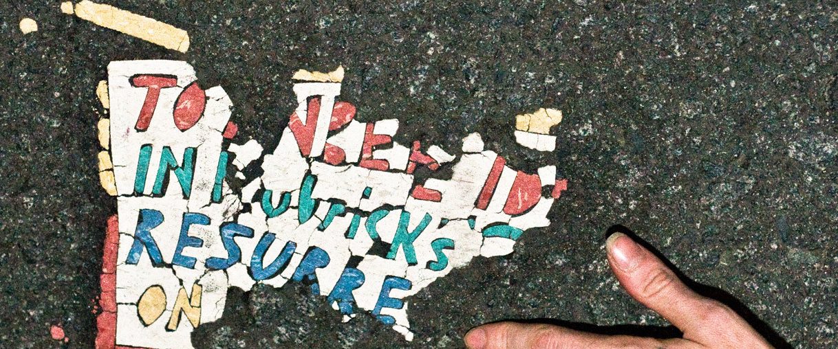 Resurrect Dead: The Mystery of the Toynbee Tiles background