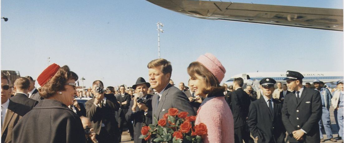 JFK Revisited: Through The Looking Glass background