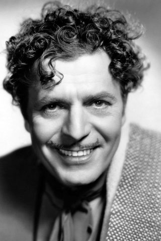 Warner Baxter, photo 1 of 3